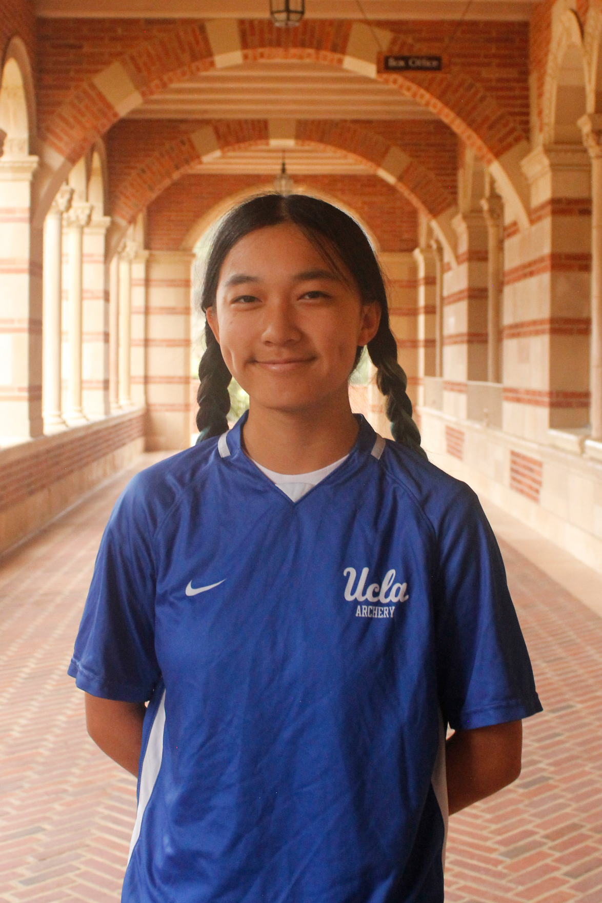 Person in blue UCLA sports shirt.